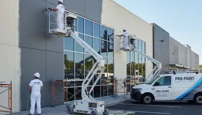 Professional commercial painters working on office exterior in Minneapolis, MN